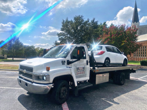 Flatbed rollback towing truck in Mesquite TX